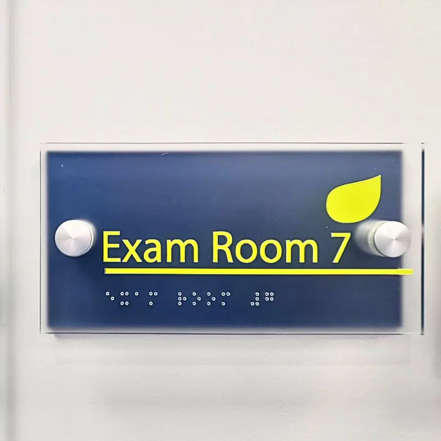 ADA room sign for Exam Room 7 with braille