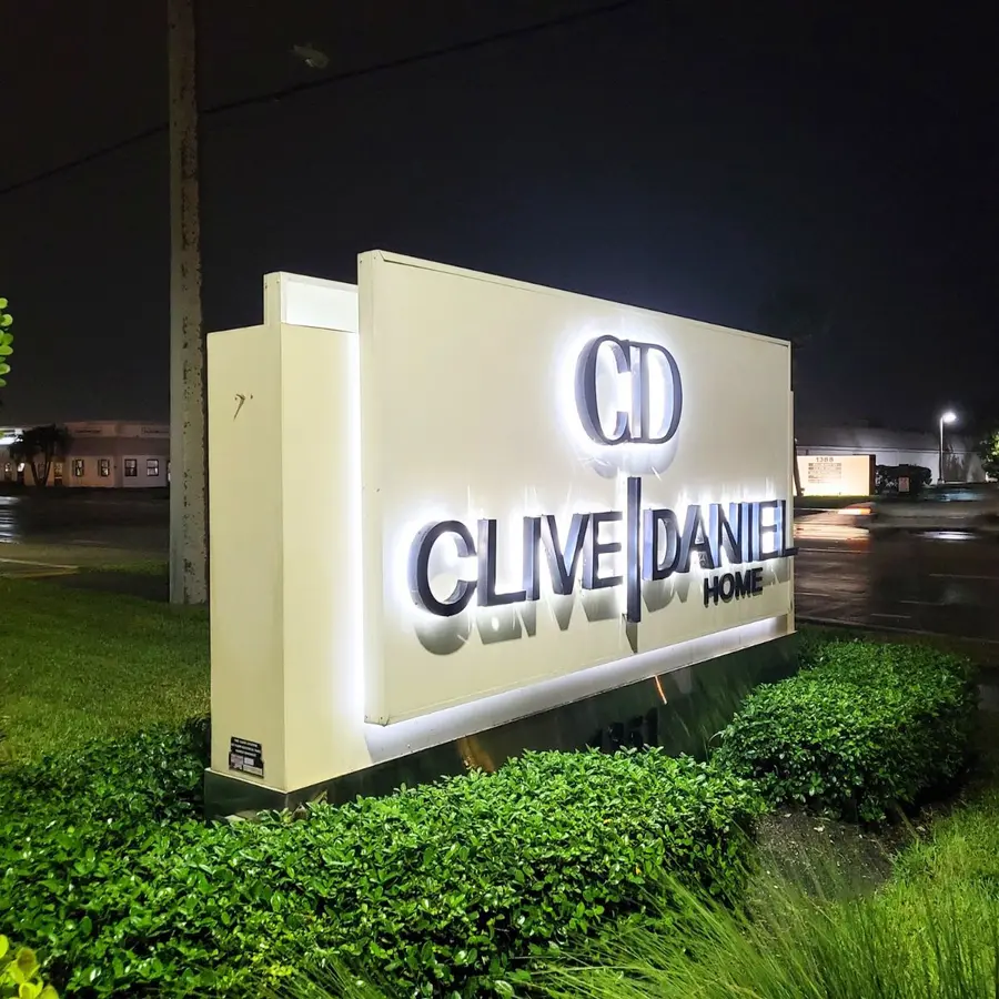 Clive Daniel Home illuminated monument sign at night